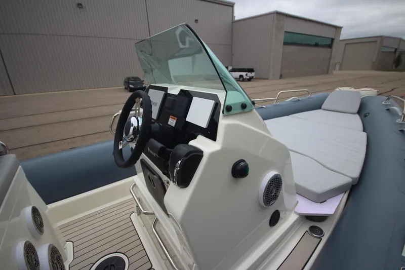 Slide: The Image of 2024 Zodiac Medline 7.5 NEO boat with modern console and seating. - 23