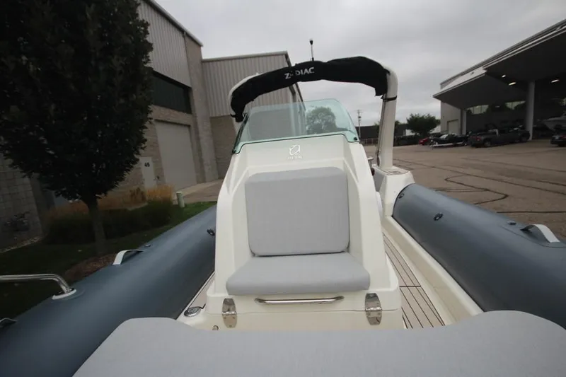 Slide: The Image of 2024 Zodiac Medline 7.5 NEO boat, sleek design, docked outdoors. - 27