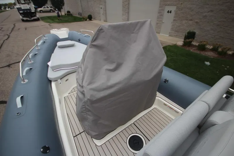 Slide: The Image of 2024 Zodiac Medline 7.5 NEO boat with covered console and seating area. - 33