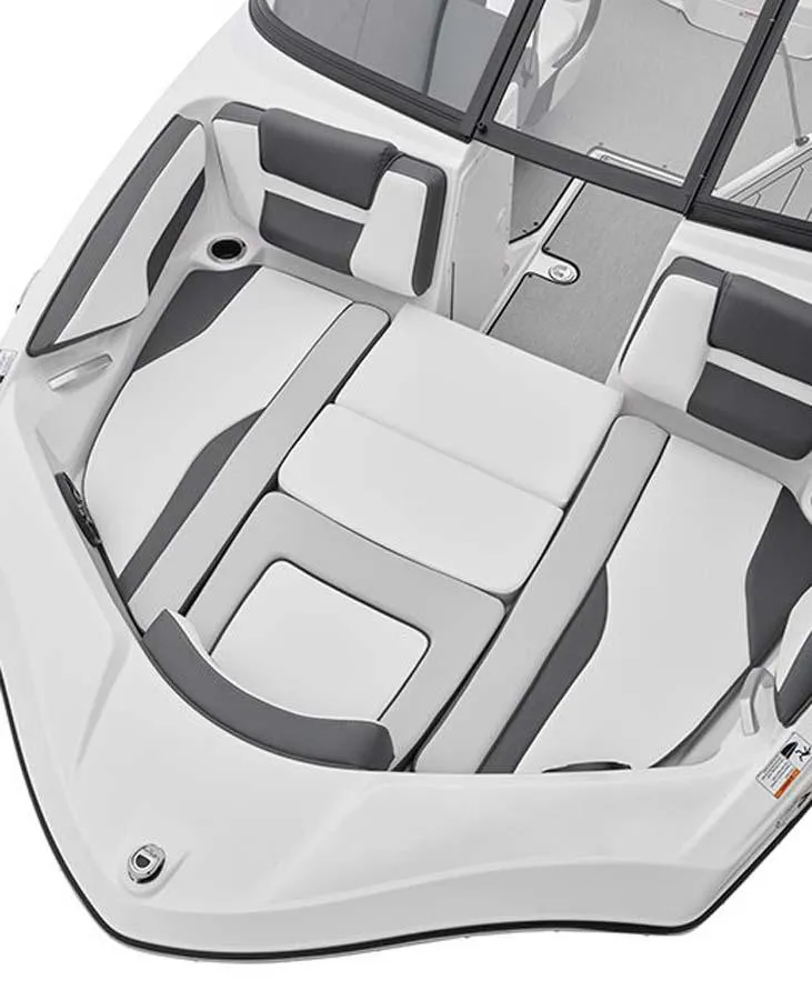 Slide: The Image of 2023 Yamaha Boats SX195 bow seating area with cushioned seats and storage. - 4
