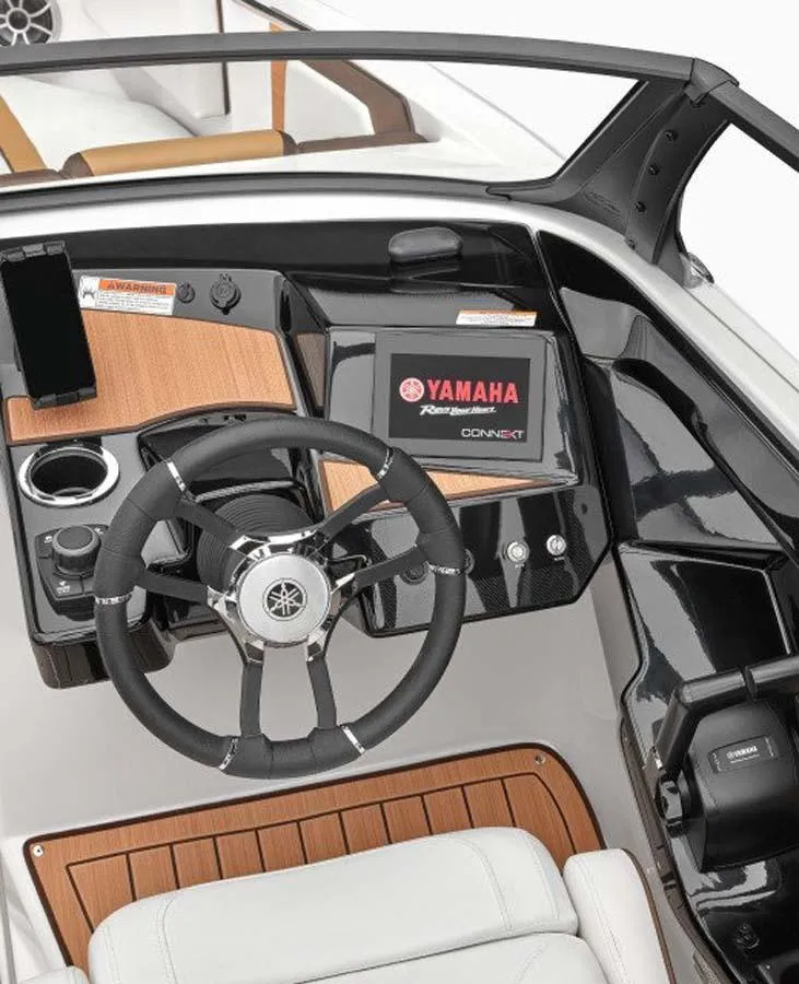 Slide: The Image of 2023 Yamaha Boats 222S dashboard with steering wheel and touchscreen display. - 5