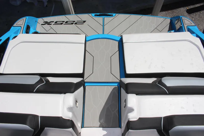 Slide: The Image of 2023 Yamaha Boats 255XE rear deck and seating area with modern design. - 15