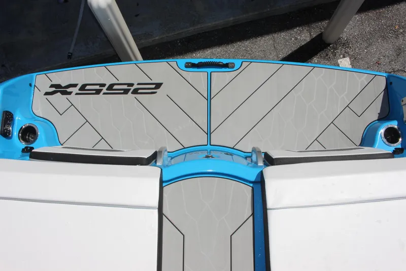 Slide: The Image of 2023 Yamaha Boats 255XE swim platform with gray and blue design. - 16