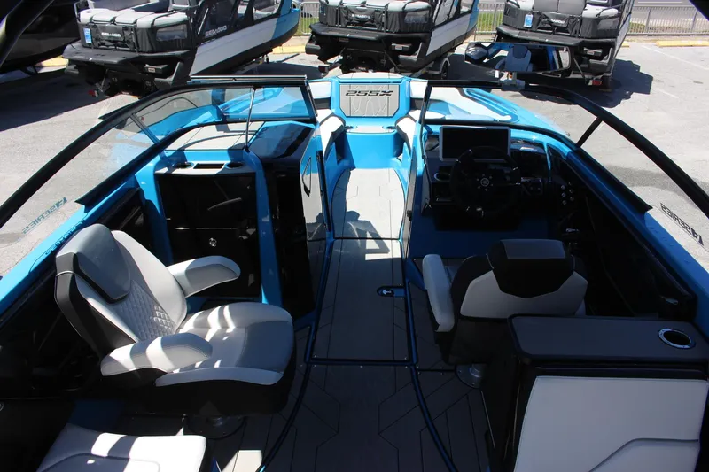 Slide: The Image of 2023 Yamaha Boats 255XE interior with modern seating and dashboard. - 4