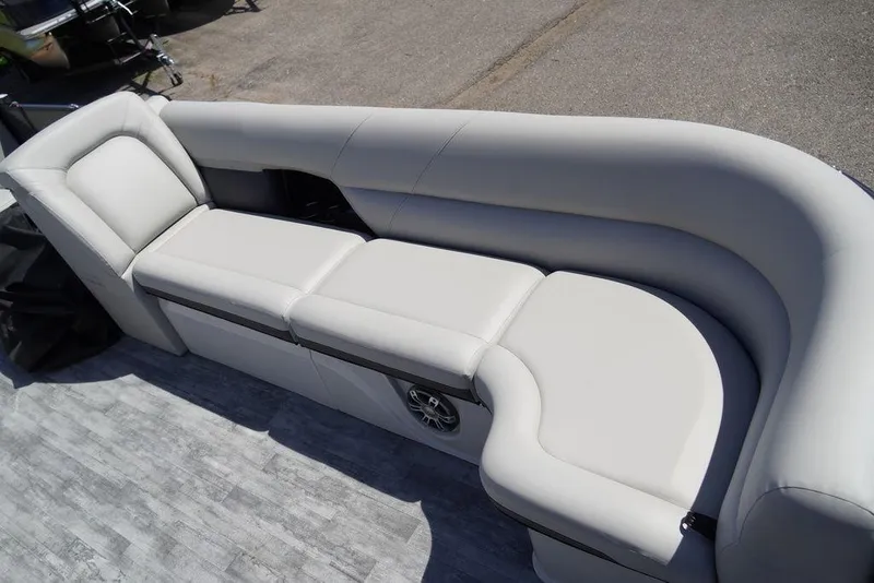 Slide: The Image of 2024 Crest Caribbean LX 250 SLC boat with luxurious white seating. - 4