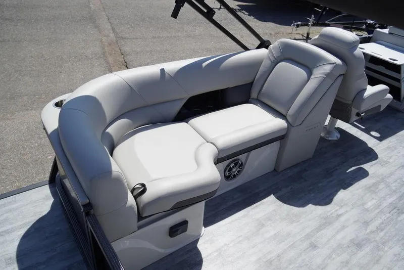 Slide: The Image of 2024 Crest Caribbean LX 250 SLC boat interior with luxurious seating. - 9