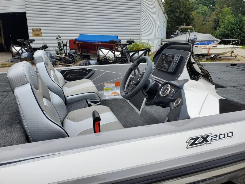 Slide: The Image of 2023 Skeeter ZX200 boat interior with steering console and seating. - 5