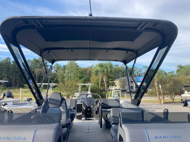 Slide: The Image of 2024 Manitou 24 EXPLORE SWITCHBACK pontoon boat with canopy and seating. - 12