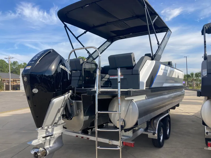 Slide: The Image of 2024 Manitou 24 EXPLORE SWITCHBACK pontoon boat with Mercury outboard motor. - 3