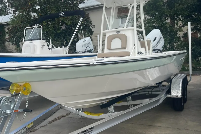 The Image of 2024 Sea Born FX21 boat on trailer, side view. - 0