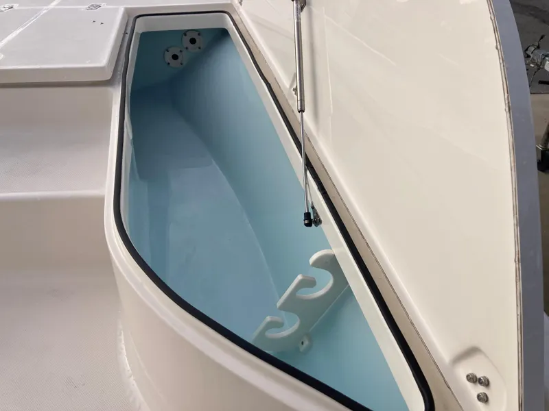 Slide: The Image of 2024 Sea Born FX21 boat storage compartment with open hatch. - 11