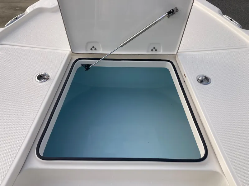 Slide: The Image of 2024 Sea Born FX21 boat storage compartment with open lid. - 12