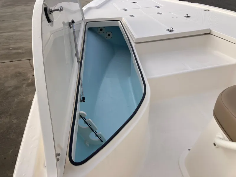 Slide: The Image of 2024 Sea Born FX21 boat storage compartment with open lid. - 13