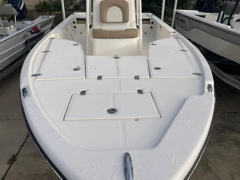 Slide: The Image of 2024 Sea Born FX21 boat with spacious deck and seating. - 14