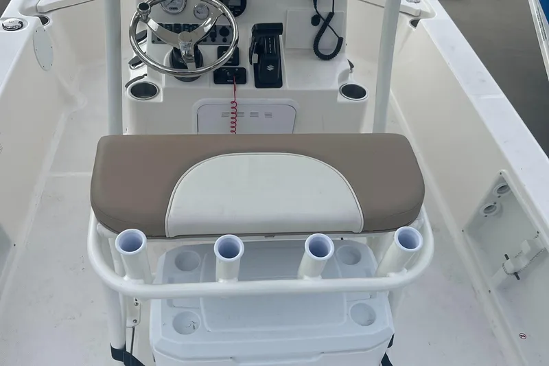 Slide: The Image of 2024 Sea Born FX21 boat console with steering wheel and seating. - 4