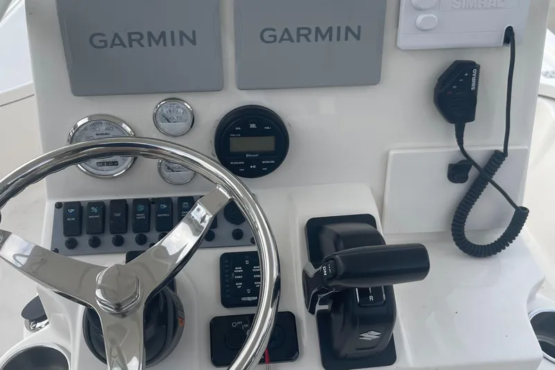 Slide: The Image of 2024 Sea Born FX21 boat console with Garmin navigation and control systems. - 5
