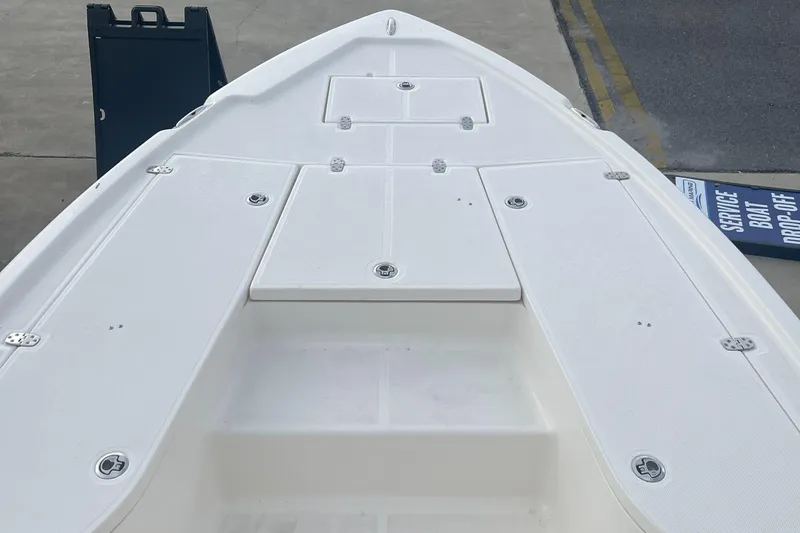 Slide: The Image of 2024 Sea Born FX21 boat deck with storage compartments. - 6