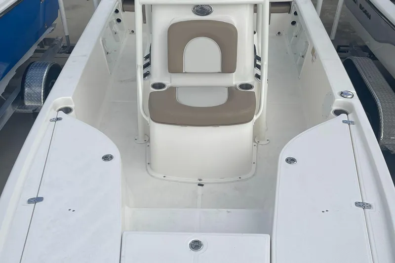 Slide: The Image of 2024 Sea Born FX21 boat interior with seating and storage compartments. - 7