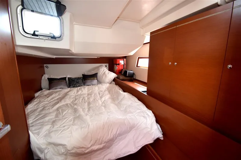 Slide: The Image of Luxurious cabin interior of 2019 Beneteau 51.1 yacht with cozy bedding. - 16