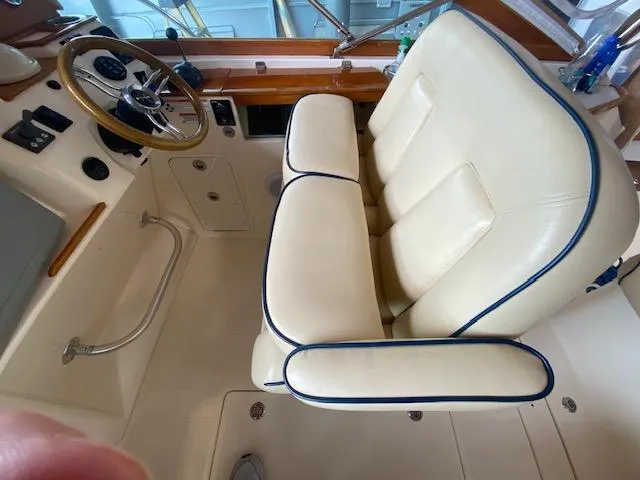 Slide: The Image of 2009 Hunt Yachts Harrier 29 interior with cream seating and wooden accents. - 5
