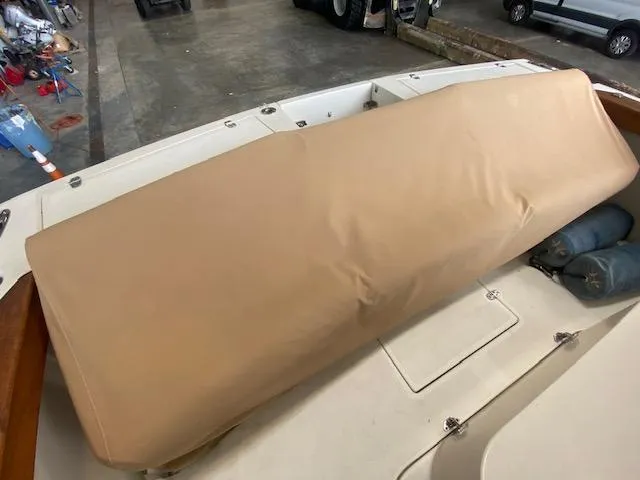 Slide: The Image of 2009 Hunt Yachts Harrier 29 interior with helm seat and storage compartments. - 7