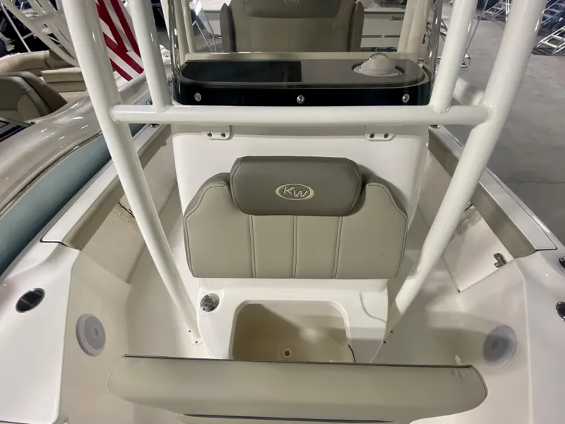 Slide: The Image of 2024 Key West 230 Bay Reef boat interior with seating and console. - 20