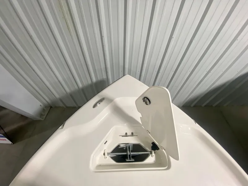 Slide: The Image of 2024 Key West 230 Bay Reef boat bow with anchor hatch open. - 26