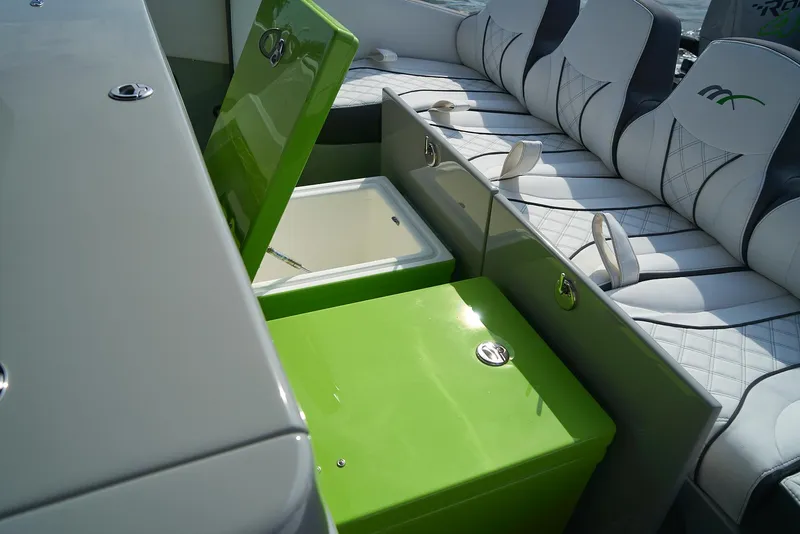 Slide: The Image of 2021 Midnight Express 43' Open boat with green storage compartment and white seating. - 14