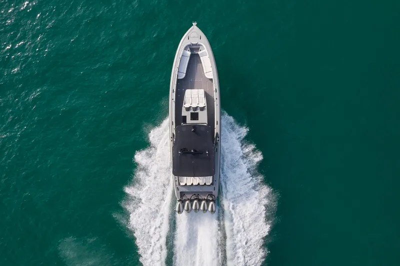 Slide: The Image of Aerial view of 2021 Midnight Express 43' Open boat cruising on clear water. - 5