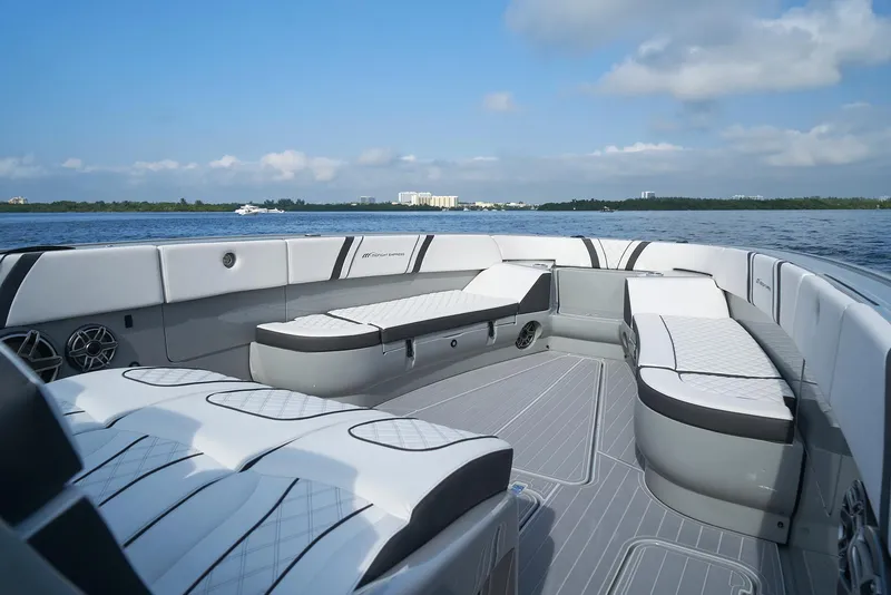 Slide: The Image of 2021 Midnight Express 43' Open luxury boat interior with white seating. - 9