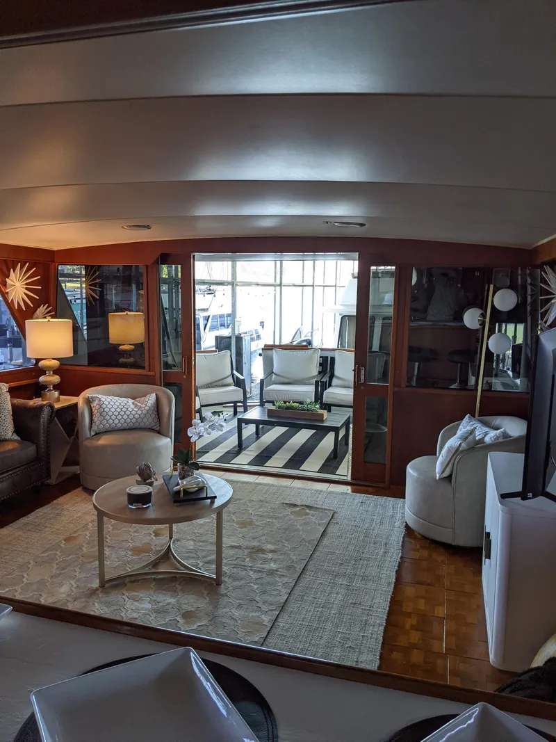 Slide: The Image of Luxurious interior of a 1976 Chris-Craft Roamer yacht with modern furnishings. - 20