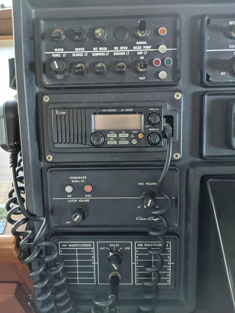 Slide: The Image of 1976 Chris-Craft Roamer control panel with communication and navigation equipment. - 32