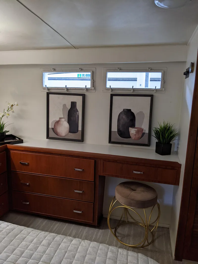 Slide: The Image of 1976 Chris-Craft Roamer interior with modern decor and wooden cabinetry. - 47