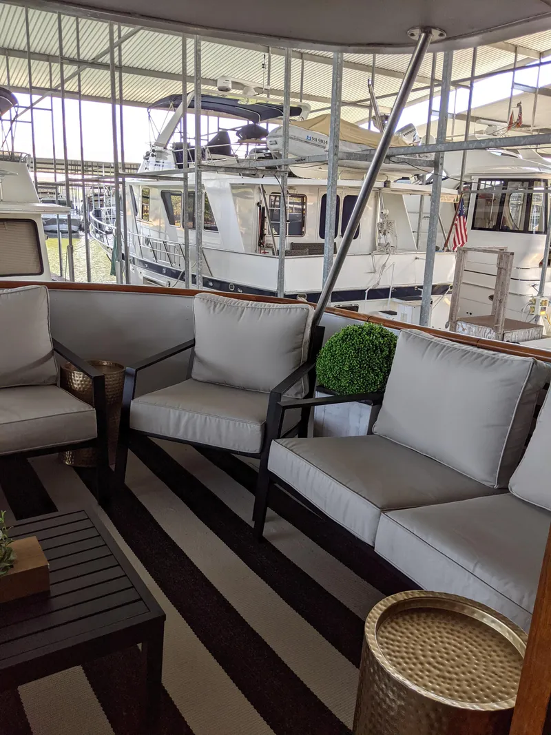 Slide: The Image of 1976 Chris-Craft Roamer yacht with comfortable outdoor seating area. - 6