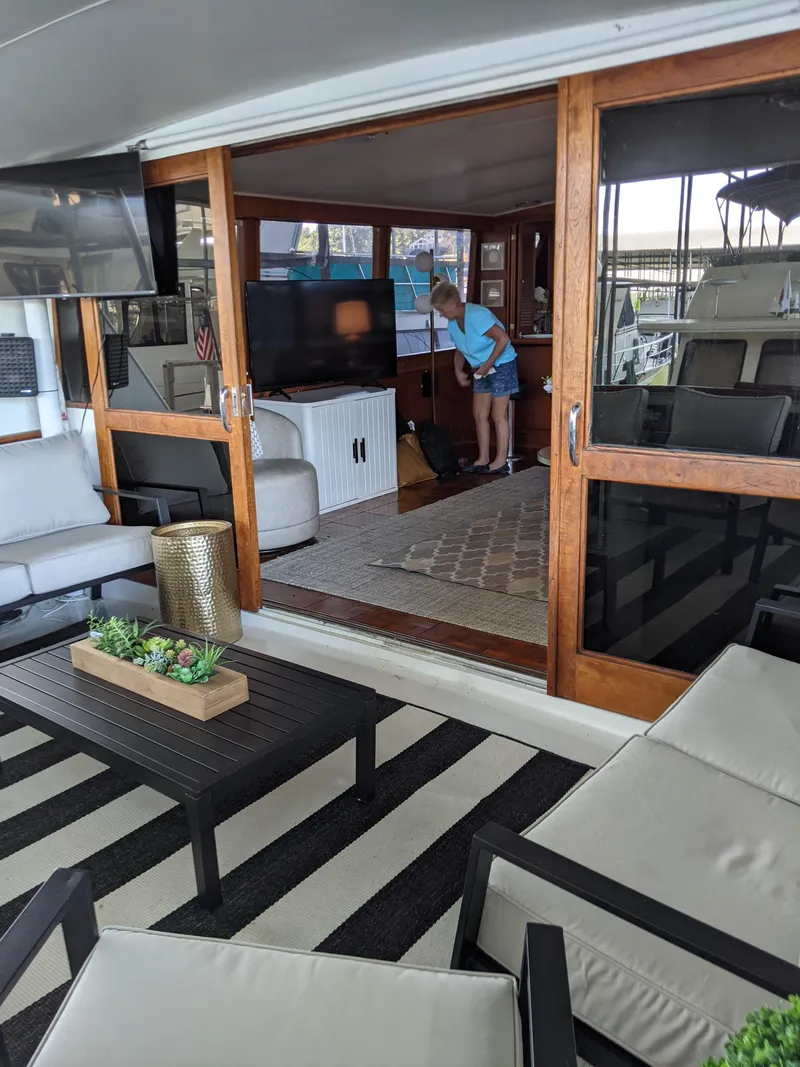 Slide: The Image of 1976 Chris-Craft Roamer yacht interior with modern furnishings and striped rug. - 8
