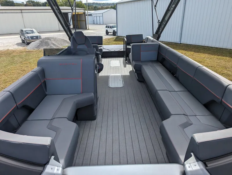 Slide: The Image of 2024 Manitou Explore 22 MAX w/150 Rotax pontoon boat interior with spacious seating. - 8