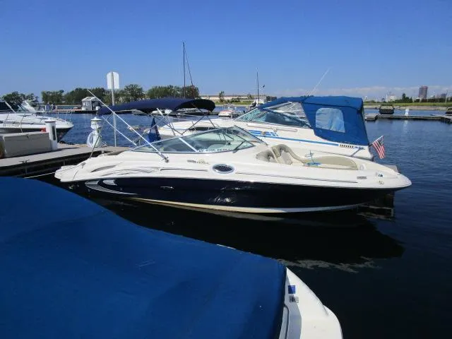 The Image of 2005 Sea Ray 270 Sundeck boat docked at a marina. - 1