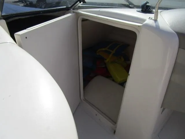 Slide: The Image of Storage compartment on a 2005 Sea Ray 270 Sundeck boat with life jackets inside. - 20