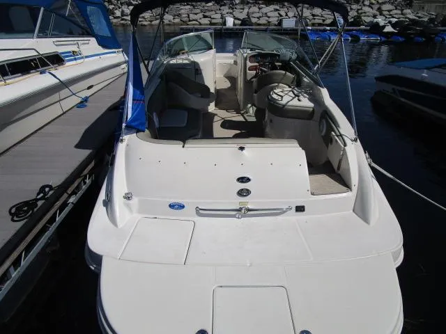 Slide: The Image of 2005 Sea Ray 270 Sundeck boat docked at marina, rear view. - 3