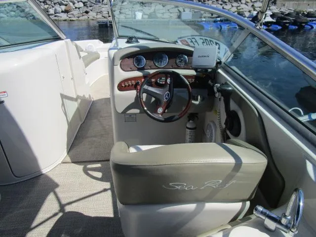 Slide: The Image of 2005 Sea Ray 270 Sundeck boat interior with steering wheel and dashboard. - 4