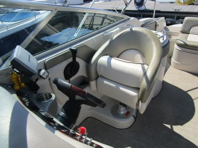 Slide: The Image of 2005 Sea Ray 270 Sundeck helm with captain's chair and control panel. - 6