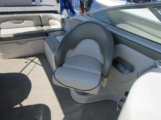 Slide: The Image of 2005 Sea Ray 270 Sundeck interior with seating and carpeted floor. - 7