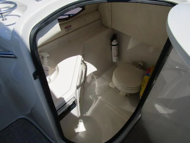Slide: The Image of 2005 Sea Ray 270 Sundeck boat interior bathroom with toilet and sink. - 9