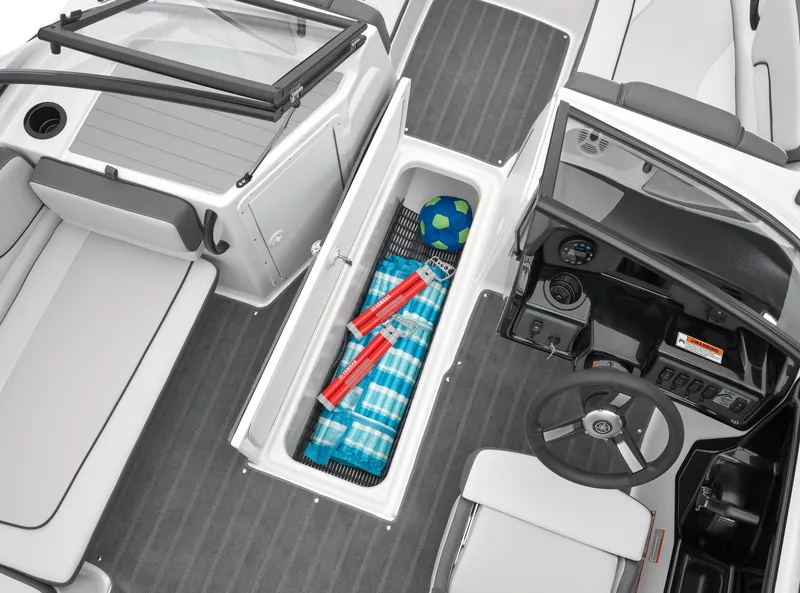 Slide: The Image of 2024 Yamaha Boats AR190 interior storage compartment with gear and accessories. - 5