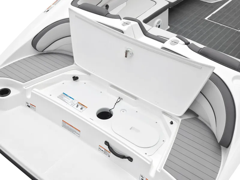 Slide: The Image of 2024 Yamaha Boats AR190 storage compartment with open lid and seating area. - 7