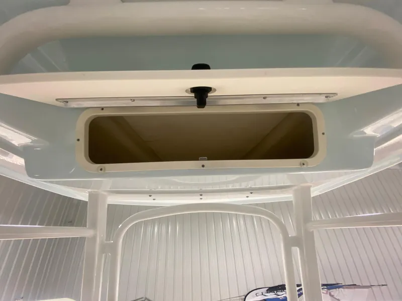 Slide: The Image of 2024 Robalo R222 Center Console storage compartment. - 13