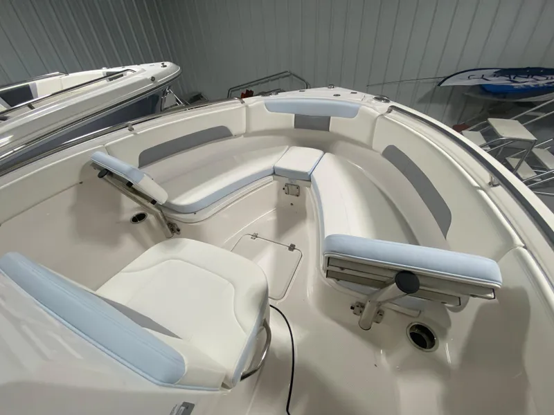 Slide: The Image of 2024 Robalo R222 Center Console boat interior with cushioned seating. - 15