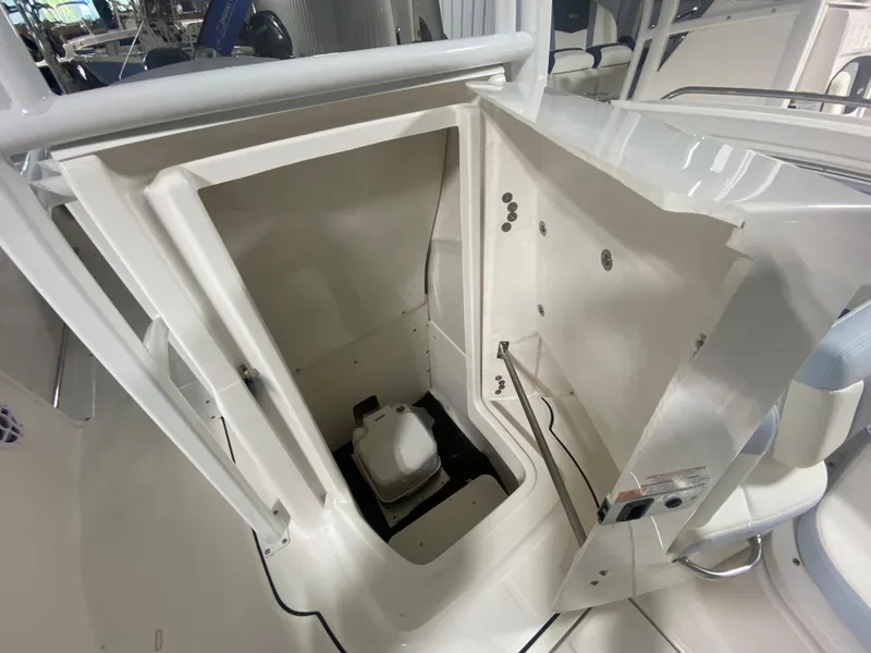 Slide: The Image of 2024 Robalo R222 Center Console boat interior storage compartment. - 16