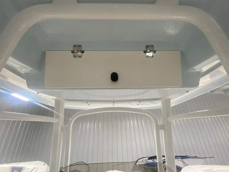 Slide: The Image of 2024 Robalo R222 Center Console interior view with overhead storage compartment. - 12