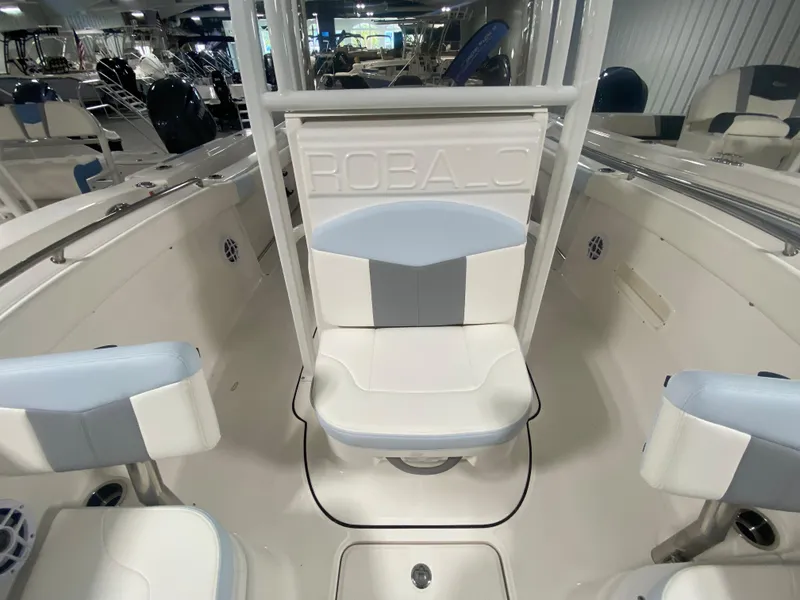 Slide: The Image of 2024 Robalo R222 Center Console boat interior with seating and console. - 21